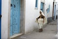 Africa. Tunisia, Nabeul. Woman in a medina