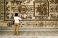 Tunisia. Tunis. A woman takes a photo of the frescoes at Bardo Museum