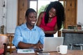 African amerian businessman at computer with woman Royalty Free Stock Photo