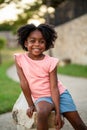 Happy African Amerian little girl smiling outside. Royalty Free Stock Photo