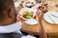 African america man eating salad at restaurant Royalty Free Stock Photo