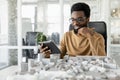 African american architect working in his office and looking busy Royalty Free Stock Photo