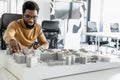 African american architect working in his office and looking involved Royalty Free Stock Photo
