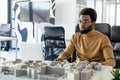 African american architect working in his office and looking involved Royalty Free Stock Photo