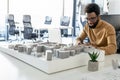African american architect working in his office and looking involved Royalty Free Stock Photo