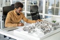 African american architect working in his office and looking involved Royalty Free Stock Photo