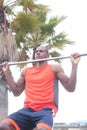 African American athlete doing pullups Royalty Free Stock Photo