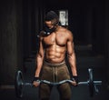 African american athletic man in mask looking at arm and lifting barbell on biceps. Exercise for biceps with barbell. black man in Royalty Free Stock Photo