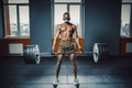 African american athletic man in sport mask doing deadlift with heavy barbell. black man lifting barbell opposite window. emotiona Royalty Free Stock Photo