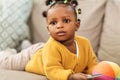 African american baby girl with smartphone at home Royalty Free Stock Photo