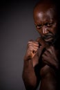 African-American boxer about to throw a punch.