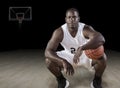 African American Basketball Player on the hardwood court Royalty Free Stock Photo