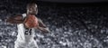 African American Basketball Player in a large basketball arena Royalty Free Stock Photo