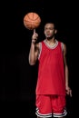 African american basketball player posing and balancing ball Royalty Free Stock Photo