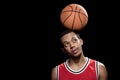 African american basketball player posing and balancing ball on head Royalty Free Stock Photo