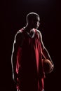 African american basketball player posing with ball Royalty Free Stock Photo