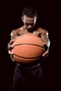 African american basketball player posing with ball Royalty Free Stock Photo