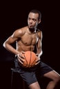 African american basketball player posing with ball Royalty Free Stock Photo