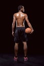 African american basketball player posing with ball Royalty Free Stock Photo