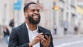 African American bearded man with smartphone navigation application looking for address using online map app in mobile