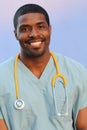 African-American black doctor man isolated on blue background Royalty Free Stock Photo