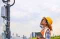 African American black female engineer was checking the readiness of a communication tower