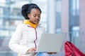 African american black female student remote studing, looking, using laptop outdoor Royalty Free Stock Photo