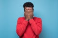 African american black man covering eyes being stressed trying to stay anonym. Royalty Free Stock Photo