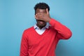 African american black man covering eyes being stressed trying to stay anonym. Royalty Free Stock Photo