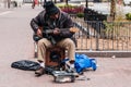 Old man homeless playing guitar begging for money to survive