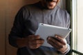 African american black man using electronic tablet at home Royalty Free Stock Photo