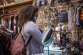 Black woman wearing a mask is shopping around for clothes Royalty Free Stock Photo