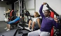 African american bodybuilder in gym is engaged in simulators Royalty Free Stock Photo
