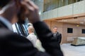 african american bodyguard protecting senior businesswoman