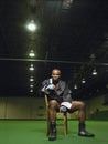 African American Boxer Sitting On Chair