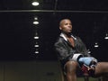 African American Boxer Sitting On Chair