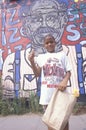 An African-American boy in front of a mural Royalty Free Stock Photo
