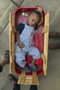 African-American boy sleeping in little Red Wagon in Central GA Royalty Free Stock Photo