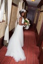 African american bride smiling at the camera holding bouquet Royalty Free Stock Photo
