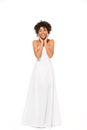 African american bride smiling while standing in wedding dress isolated on white Royalty Free Stock Photo