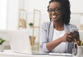 African American Business Girl Texting On Phone At Workplace Royalty Free Stock Photo