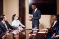 African American business man giving presentation to associates Royalty Free Stock Photo
