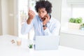 African American business man talking on the phone annoyed and frustrated shouting with anger, crazy and yelling with raised hand, Royalty Free Stock Photo