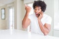 African American business man talking on the phone annoyed and frustrated shouting with anger, crazy and yelling with raised hand, Royalty Free Stock Photo