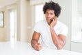 African American business man talking on the phone with a confident expression on smart face thinking serious Royalty Free Stock Photo