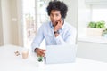 African American business man talking on the phone with a confident expression on smart face thinking serious Royalty Free Stock Photo