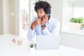 African American business man talking on the phone serious face thinking about question, very confused idea Royalty Free Stock Photo