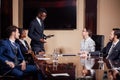 African American business man giving presentation to associates Royalty Free Stock Photo