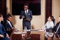 African American business man giving presentation to associates Royalty Free Stock Photo