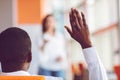 African american Business people Raising there Hand Up at a Conference to answer a question Royalty Free Stock Photo